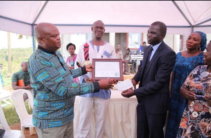 Frank Murazumi recieving an award on behalf of NAPE Uganda