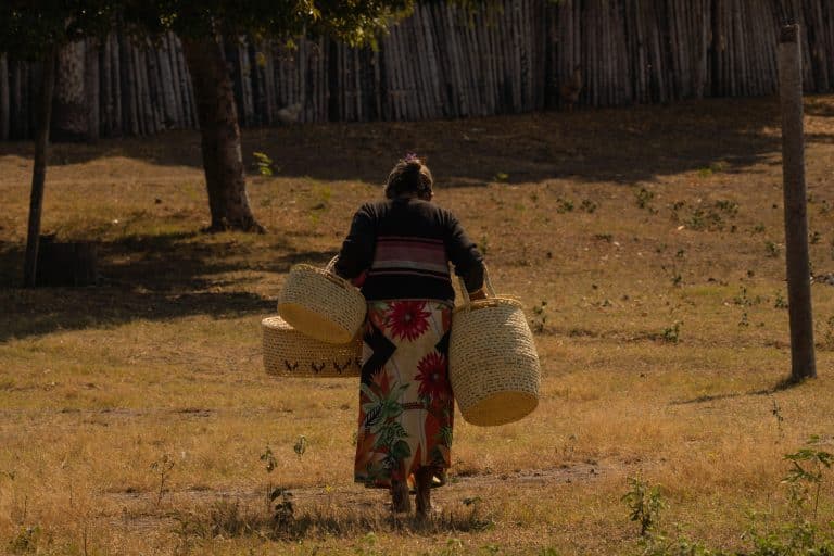 woman carries handicrafts in Paraguay
